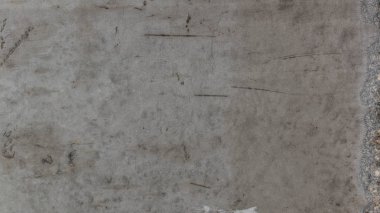 Textured background of gray concrete pavement