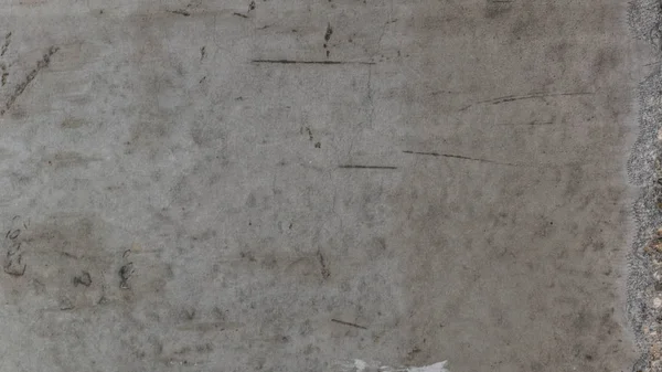 Textured background of gray concrete pavement