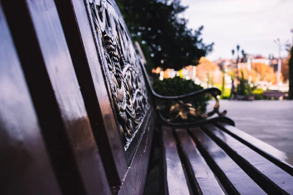 Beautiful park bench on a sunny autumn day. 2018, Tbilisi, Georgia.