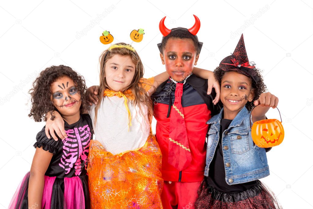 Group of kids in Halloween/Carnaval costumes isolated