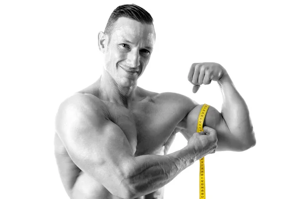 Atletický Muž Velkou Postavu Měření Jeho Biceps Izolovaný Bílém — Stock fotografie