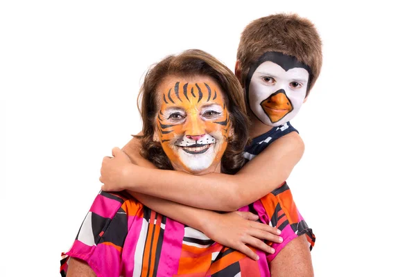 Kid and granny with face-paint — Stock Photo, Image