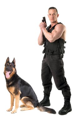 Police dog and agent with tactical vest and gun isolated in white