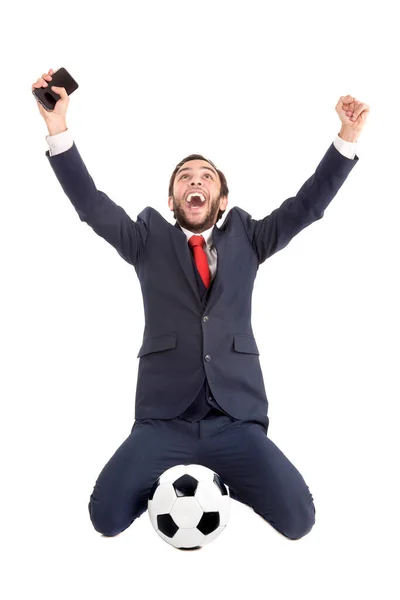 白地に孤立したサッカーボールを祝うビジネスマン — ストック写真