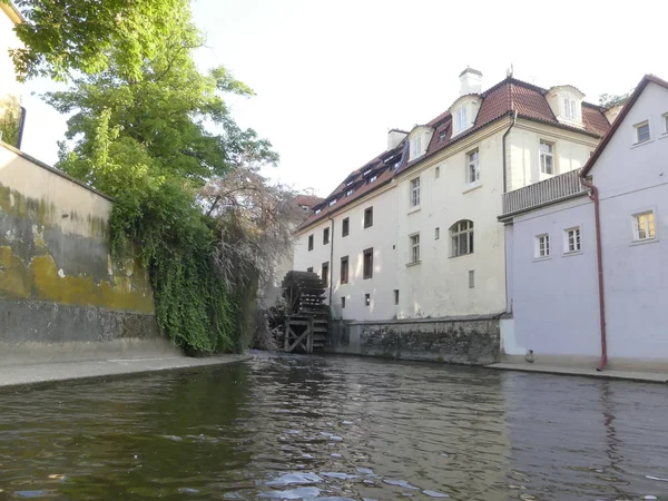 Prague, Czech Republic - May 7, 2018: A view of an ancient water mill, a wheel.