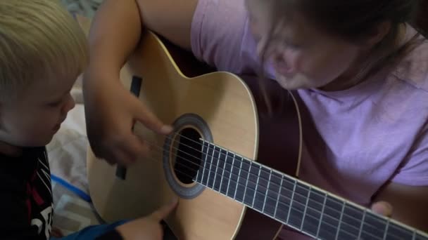 Children Learn Play Guitar Close Guitar Strings Children Hands — Stock Video