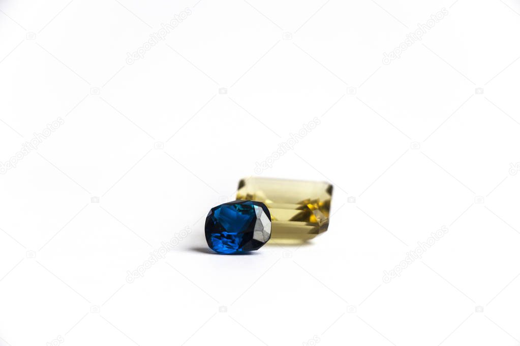 blue sapphire and yellow quartz on a white background