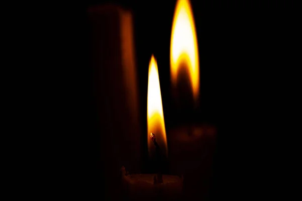 church candle on a dark background