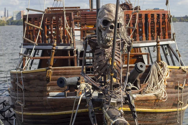 pirate skeleton on the bow of a pleasure pirate ship on the Dnieper River in Ukraine on a summer day