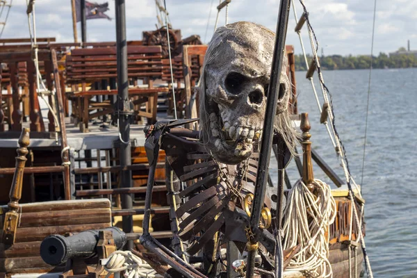 pirate skeleton on the bow of a pleasure pirate ship on the Dnieper River in Ukraine on a summer day