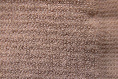 İzole bir arka plan makrosu üzerinde bej naylon çoraplar