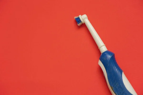 Old Electric Toothbrush Red Background — Stock Photo, Image