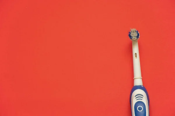 Old Electric Toothbrush Red Background — Stock Photo, Image