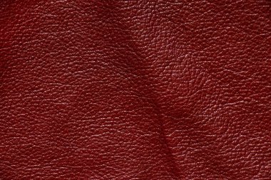 Yakın plan olarak koyu kırmızı hakiki deri.