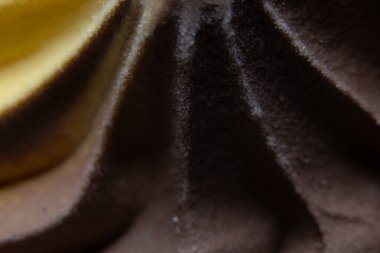 Arkadaki makro olarak çikolata portakallı dondurma dalgası