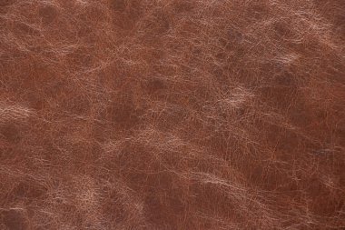 Arkaplan olarak koyu kahverengi deri makro fotoğraf