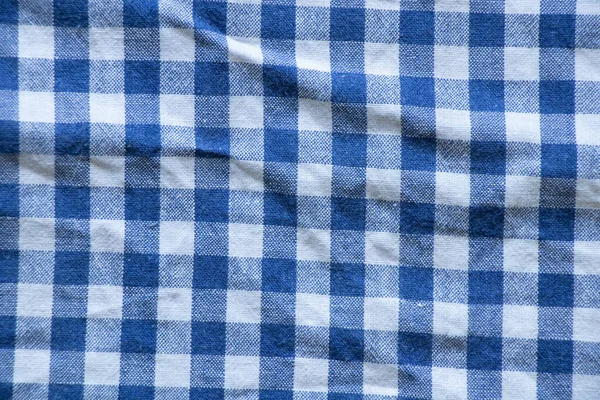 Fabric in a cage blue with white as a background close-up — Stock Image Fabric Cage Blue White Background Close Stock Photo