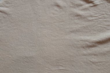 Dekorasyon için arkaplan, desen, doku veya duvar kağıdı olarak kullanılabilen açık kahverengi veya bej rengi ince örgü kumaşı