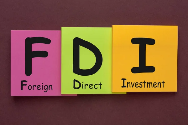 Foreign Direct Investment (FDI) written on color notes. Acronym concept.