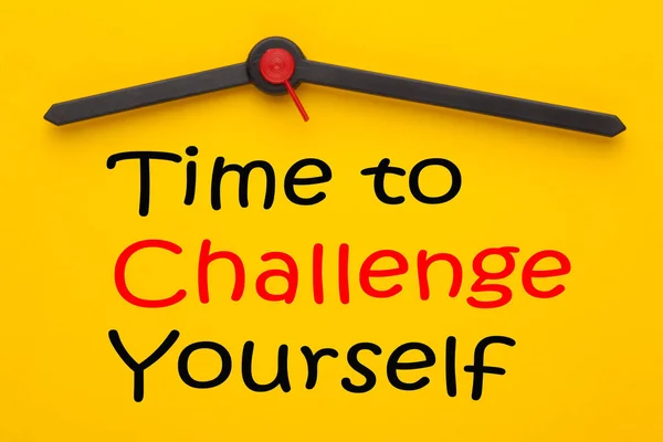 Time to Challenge Yourself written on yellow clock. Inspirational message.