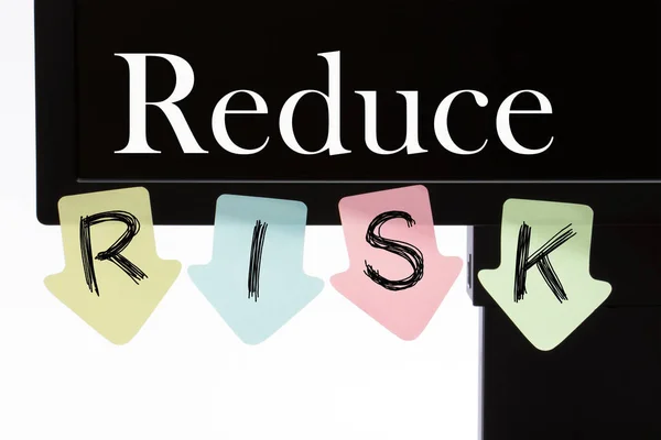 Reduce Risk written on computer display and reminder notes.