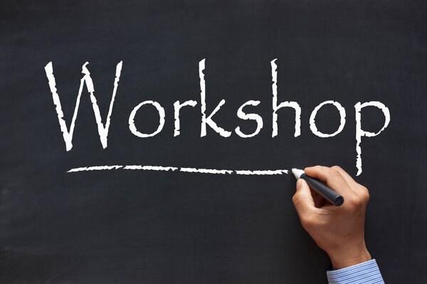 Handwriting Workshop with chalk marker on blackboard. Business Concept.