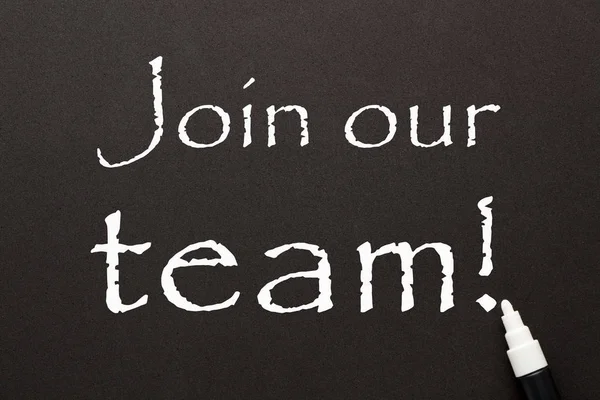 Join our team written with white chalk marker on black background. Business concept