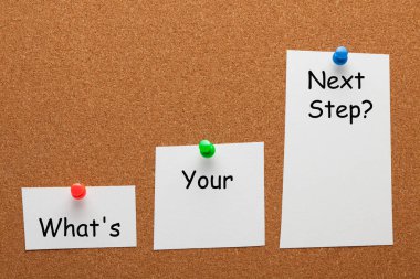 What's Your Next Step question on paper sheet with pin in the shape of a staircase on cork board. Business concept. clipart