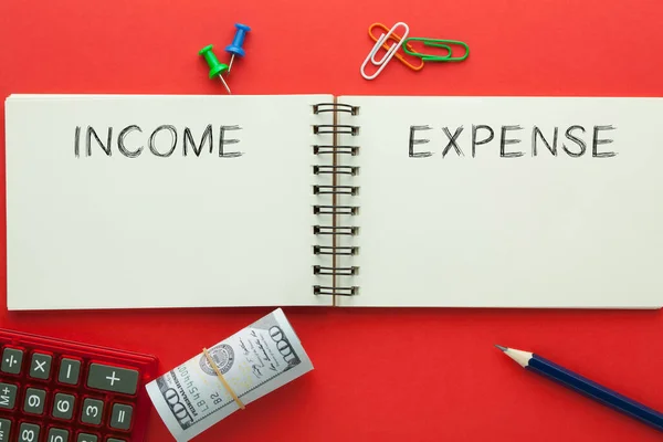 Word Income Expense Written Open Spiral Notebook Rolled 100 Dollar — Stock Photo, Image