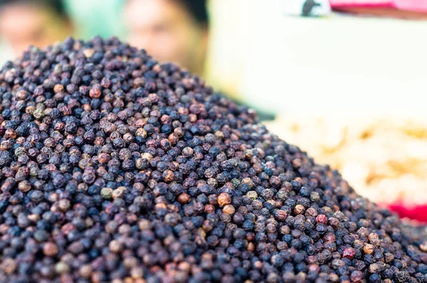 Shallow depth shot of black pepper ready for sale at a shop