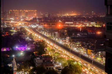 Aerial cityscape shot of Noida, delhi, grugaon at dusk night clipart