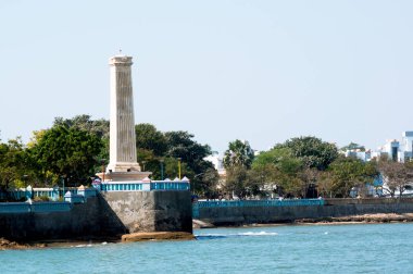 Ancient lighthouse overlooking the bay in diu gujarat india clipart