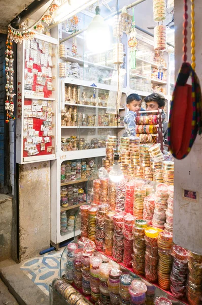 shoppers browsing the colorful night market in dwarka gujarat