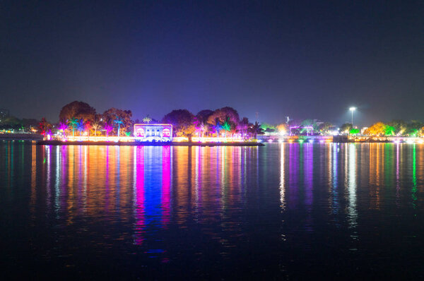 Beautiful and colorful lights reflected in the water of kankaria lake ahmedabad, gujarat