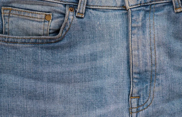 Närbild Blå Slitna Jeans Detalj Denim Bakgrund — Stockfoto