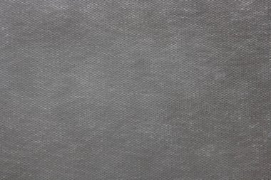 Delikli yapay malzemenin gri arka planı