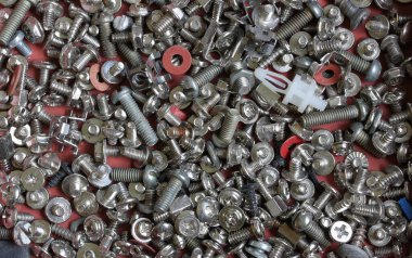 Çeşitli çap ve boyutlarda vida ve contaların arka planı