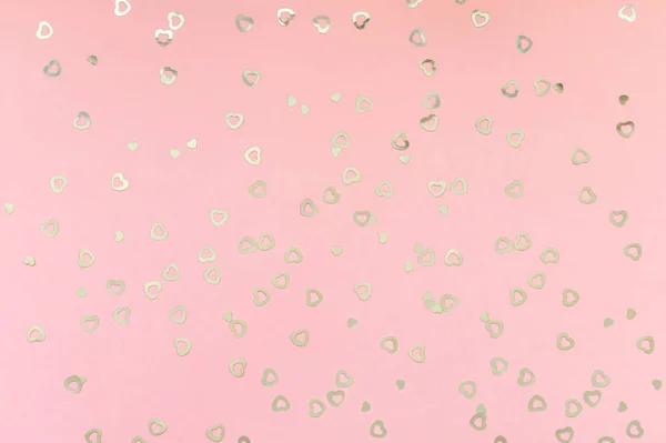 Valentines day background. Holiday blinking abstract valentine background with glowing silver hearts on pink background. Love concept. Top view, flat lay. Horizontal