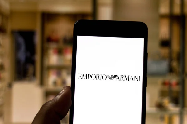 April 1, 2019, Brazil. Emporio Armani logo on the mobile device. The Emporio Armani is a famous Italian fashion company. Company manufactures various kinds of products, mainly suits — Stock Photo, Image