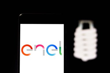 April 4, 2019, Brazil. Enel logo on the mobile device. Enel is an electric power distribution company with operations in the state of Sao Paulo, based in Barueri.  clipart