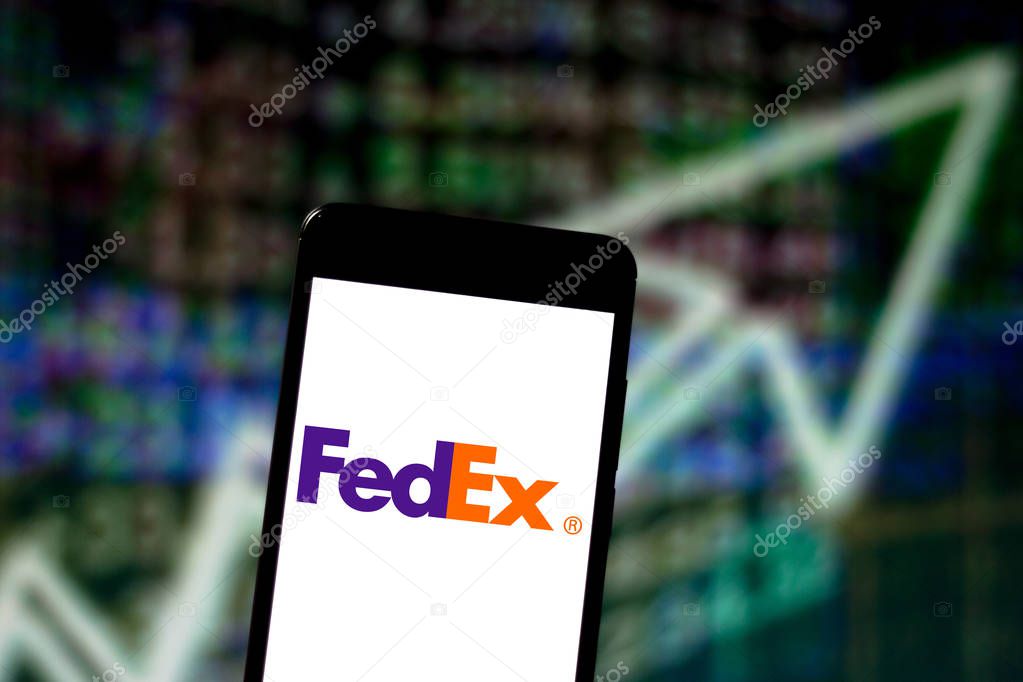 April 16, 2019, Brazil. FedEx logo on the mobile device. FedEx is an American mail order company, documents and objects.