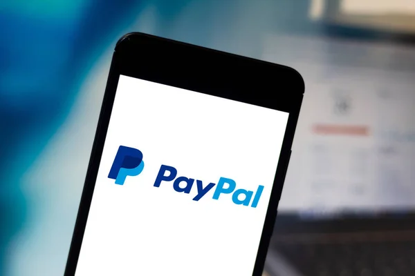 April 25, 2019, Brazil. PayPal logo on your mobile device. PayPal is an online payment company. It operates all over the world — Stock Photo, Image