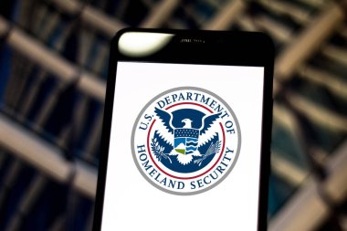 May 05, 2019, Brazil. In this photo illustration the United States Department of Homeland Security (DHS) logo is displayed on a smartphone clipart