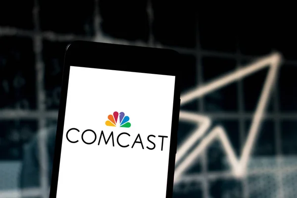 May 16, 2019, Brazil. In this photo illustration the Comcast Corporation logo is displayed on a smartphone — Stock Photo, Image