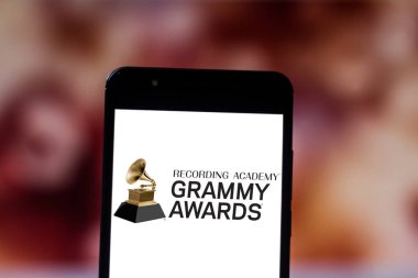 June 19, 2019, Brazil. In this photo illustration the Grammy Awards logo is displayed on a smartphone clipart