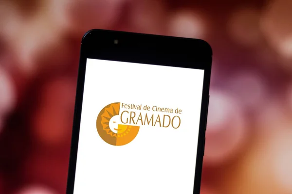 June 19, 2019, Brazil. In this photo illustration the Gramado Film Festival logo is displayed on a smartphone — Stock Photo, Image