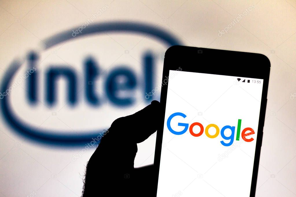 July 9, 2019, Brazil. In this photo illustration the Google logo is displayed on a smartphone. In the background, Intel Corporation logo.