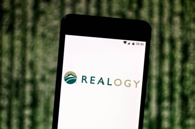 August 2, 2019, Brazil. In this photo illustration the Realogy Holdings logo is displayed on a smartphone clipart