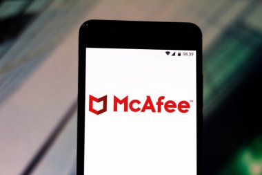August 6, 2019, Brazil. In this photo illustration the McAfee logo is displayed on a smartphone clipart