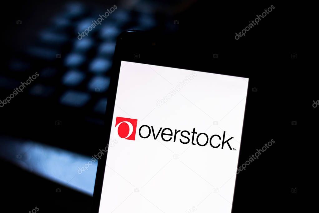 August 15, 2019, Brazil. In this photo illustration the Overstock logo is displayed on a smartphone.